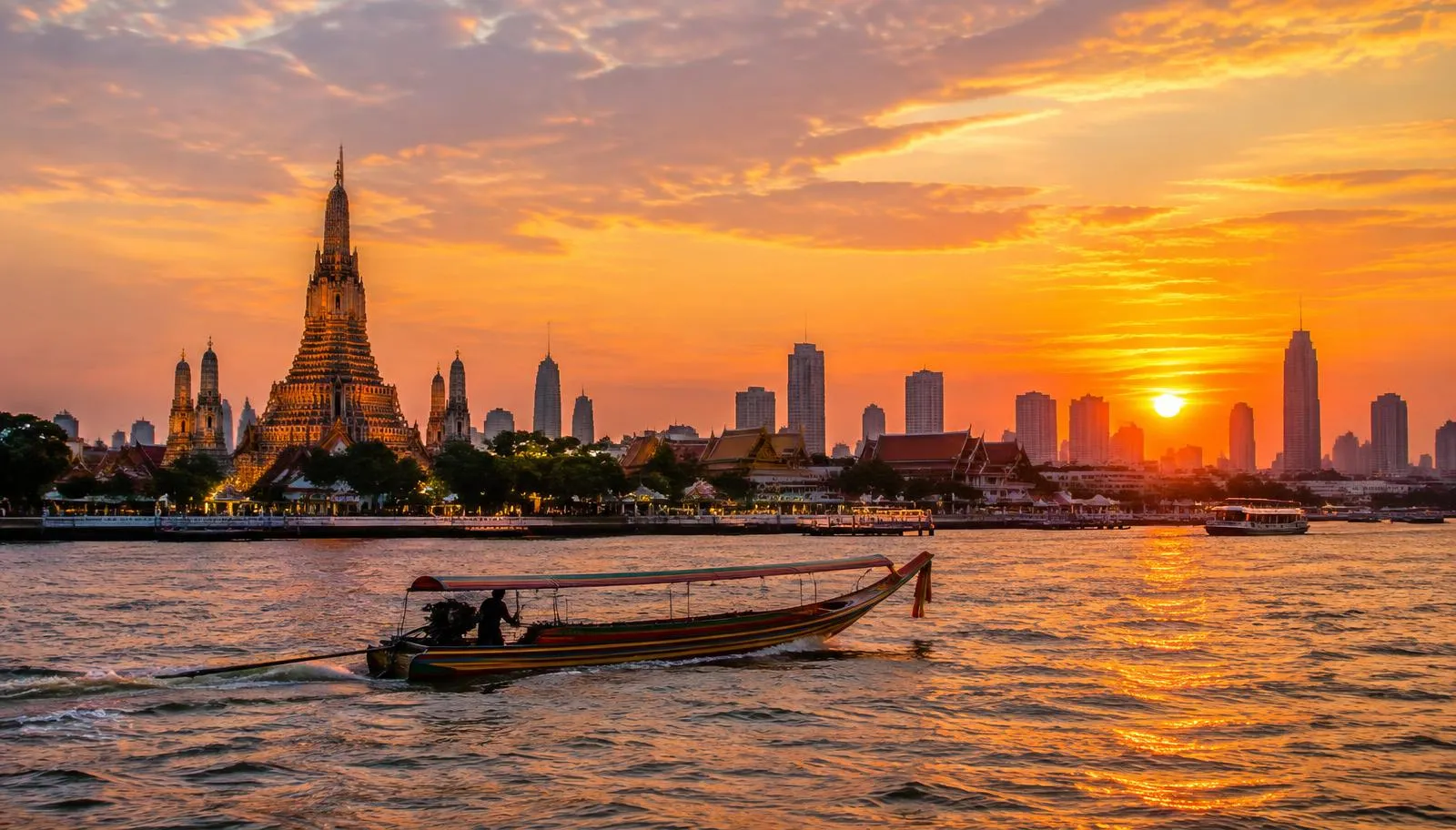 Illustration of the Bangkok skyline at sunset seen from the river